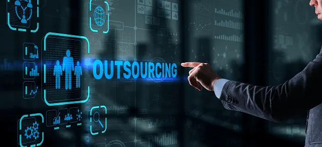 Hand touching a glowing futuristic interface with team icons and business chart symbols