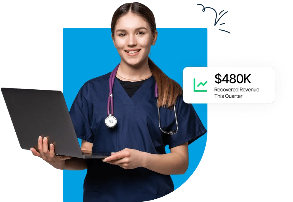 Smiling woman in navy scrubs with a stethoscope holding an open laptop